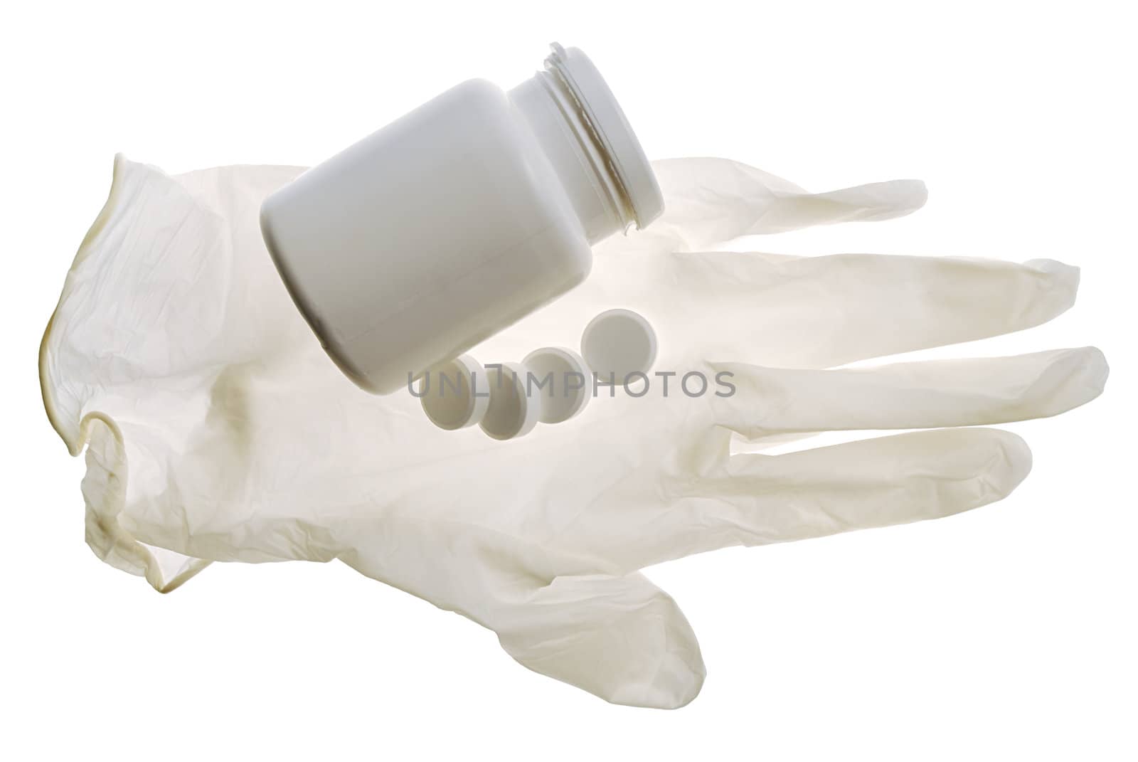 glove and some pills on a white background