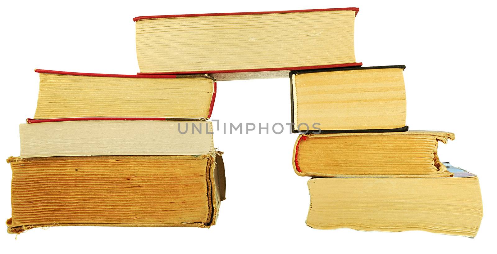 pile of old books on a white background