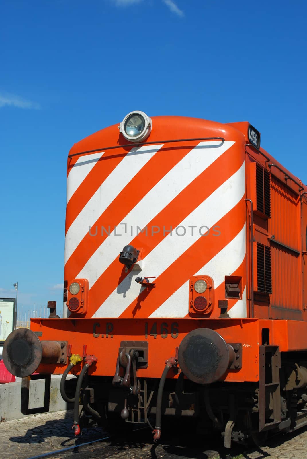 photo of a colorful transportation train with blue sky background