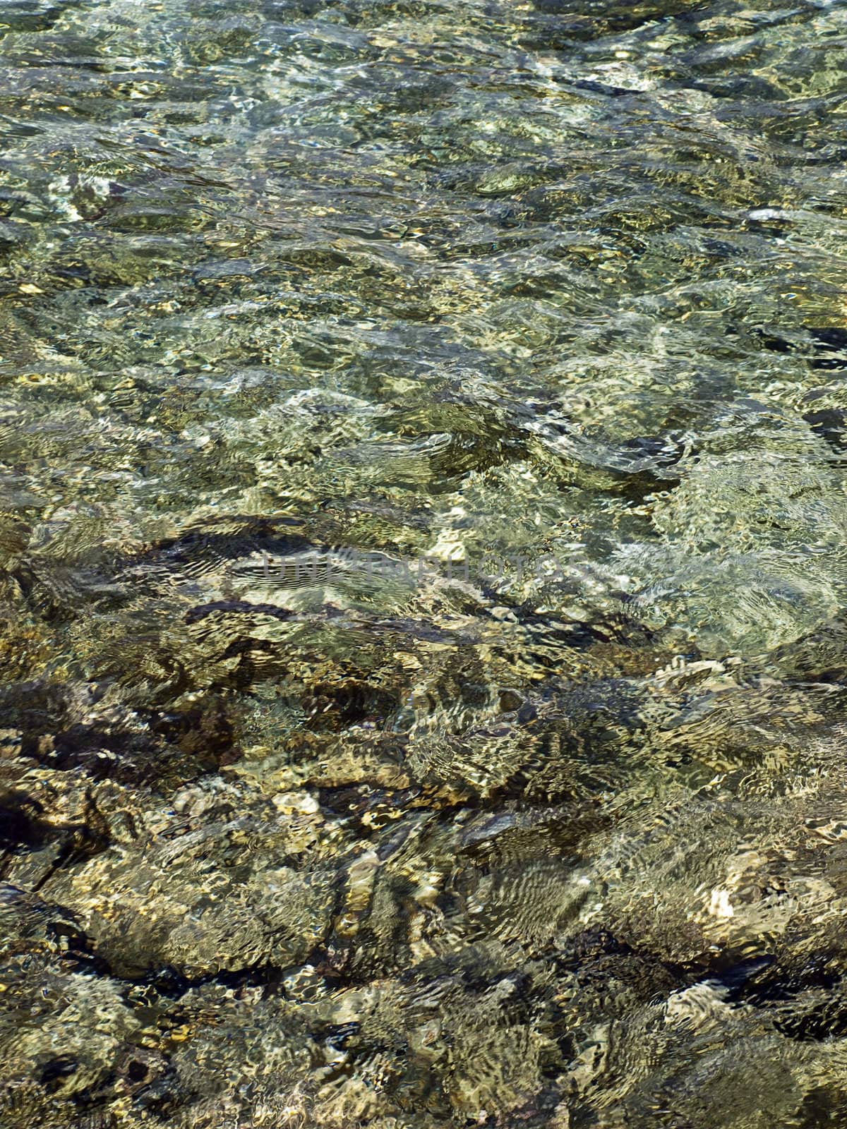 Abstract image showing a crystal clear shallow part of seawater