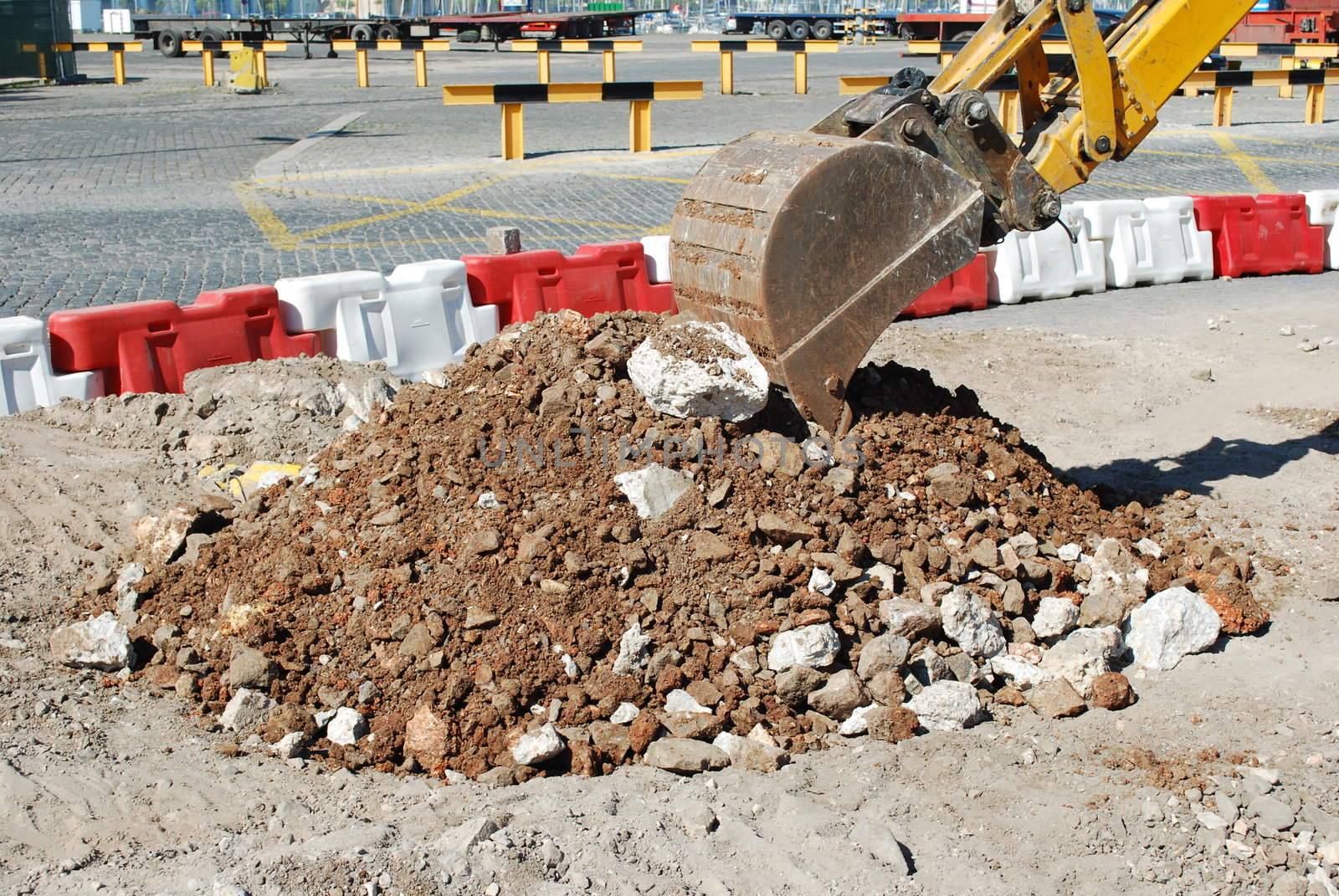 photo of caterpillar excavating at a construction site