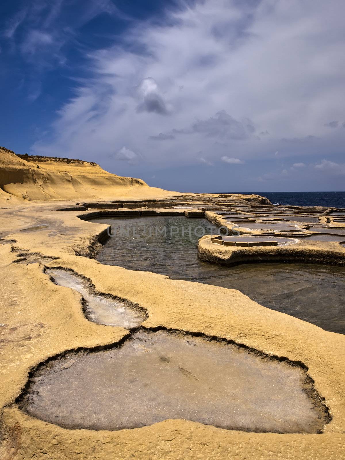 Old saltpanes carved in sandstone in Qbajjar in Gozo