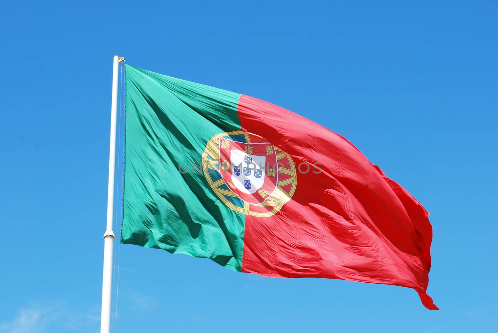 portuguese flag against blue sky background