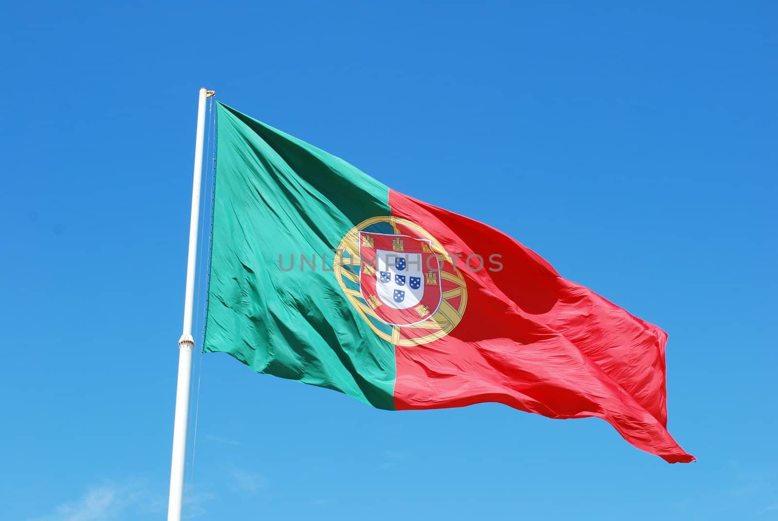 portuguese flag against blue sky background