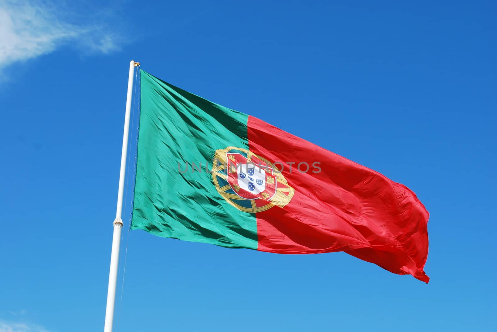 portuguese flag against blue sky background