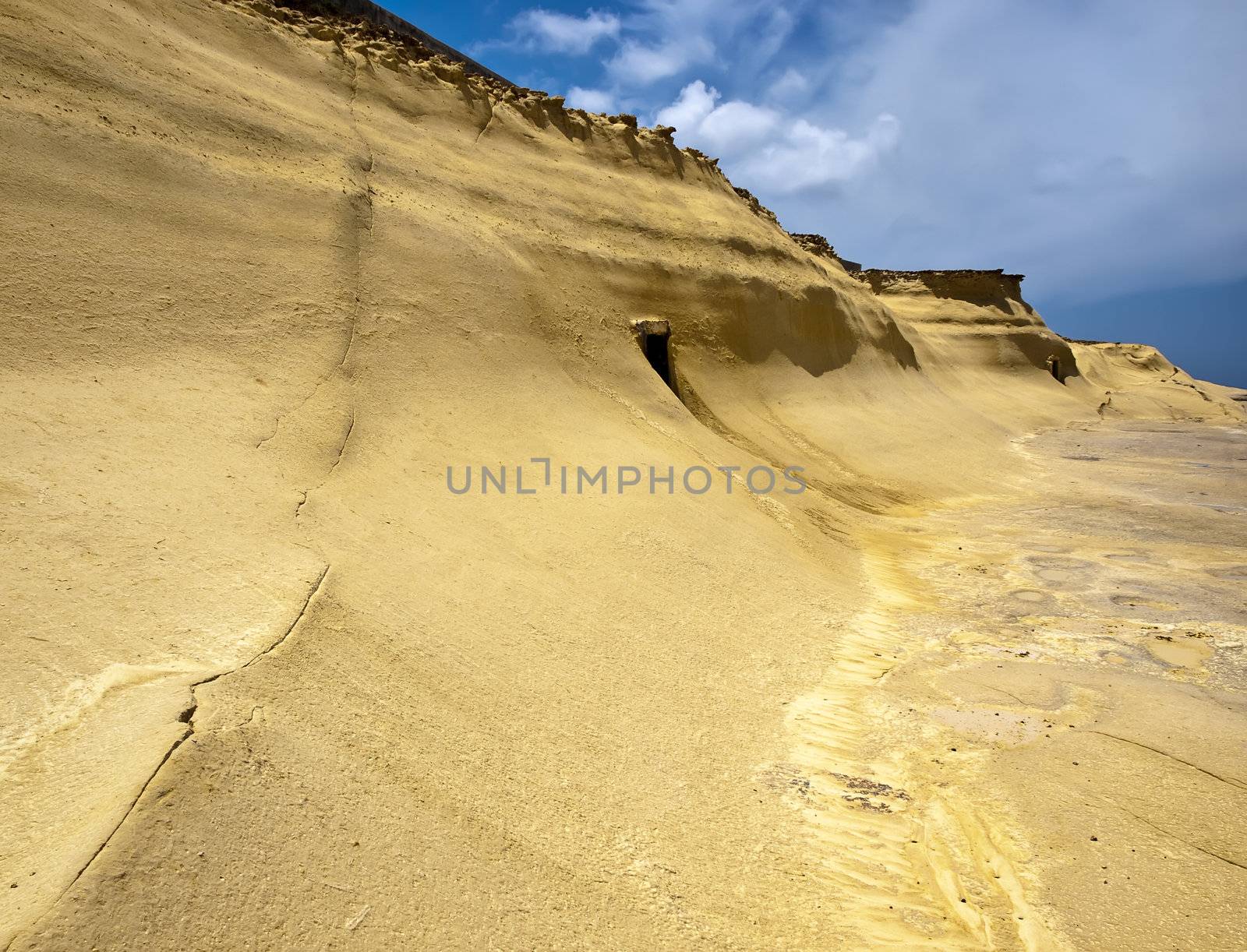 Beautiful and unique eroded sandstone cliff faces at Qbajjar in Gozo