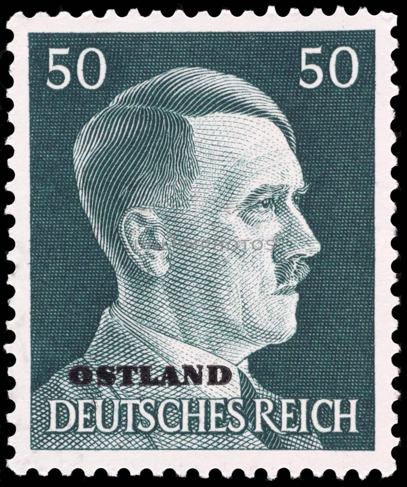 Adolf Hitler on German stamp isolated in black