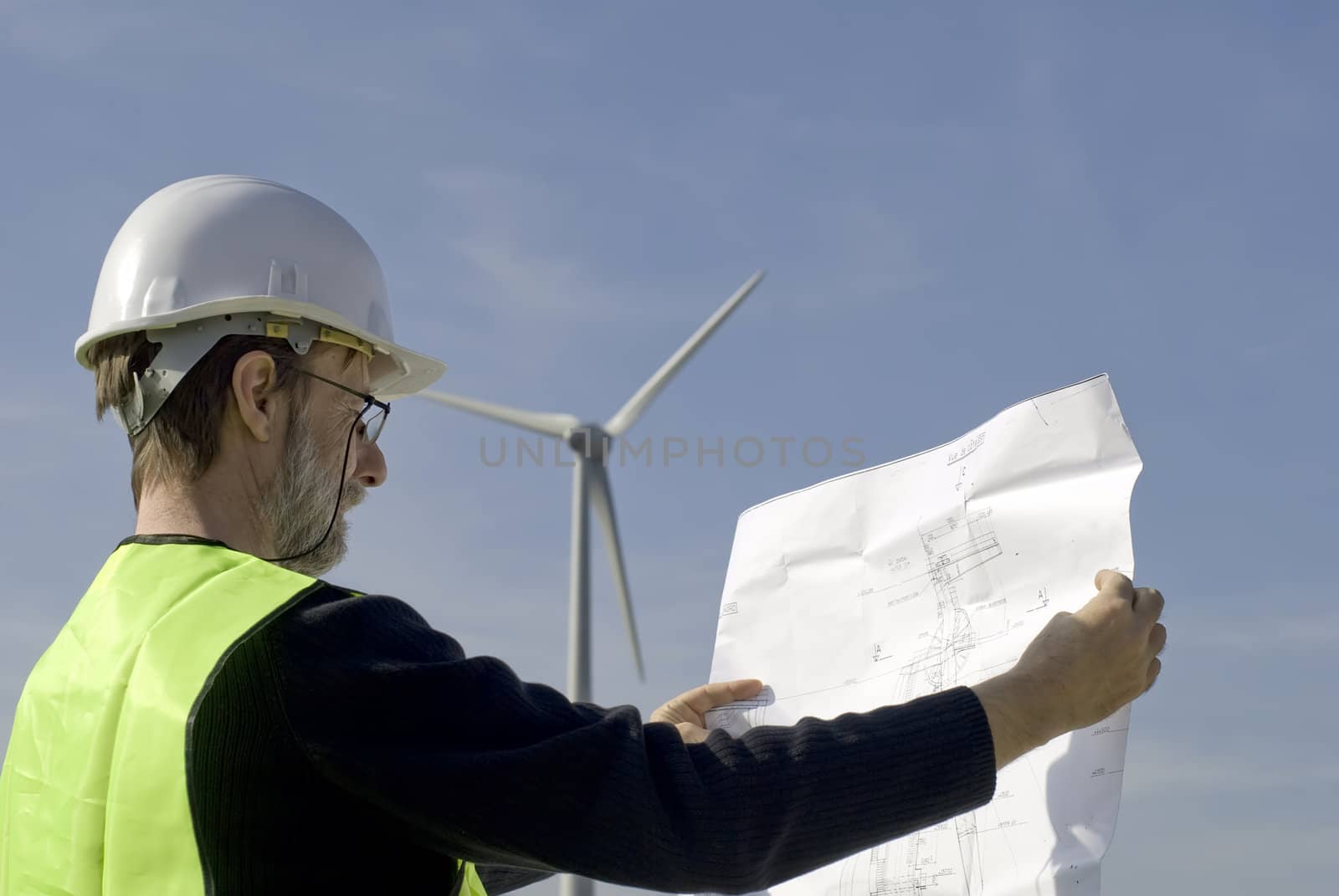 technician on site  reading a map