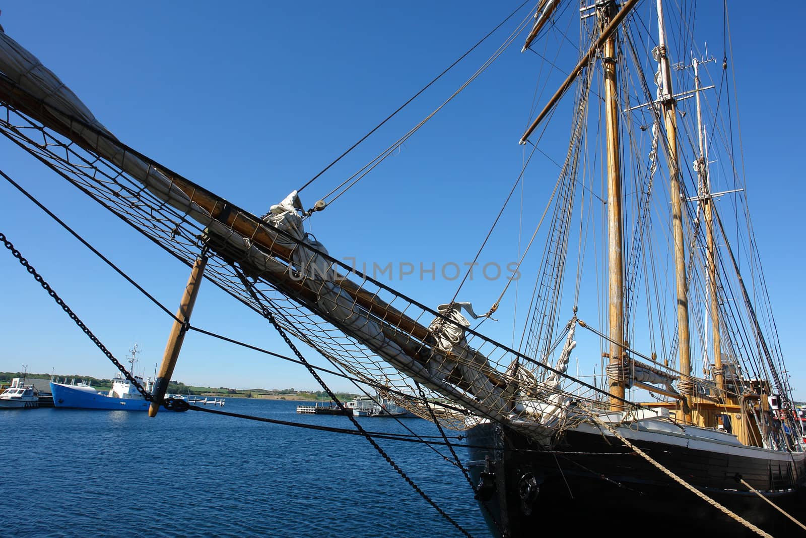 Old beautiful vintage wooden sail boat tall ship marine background