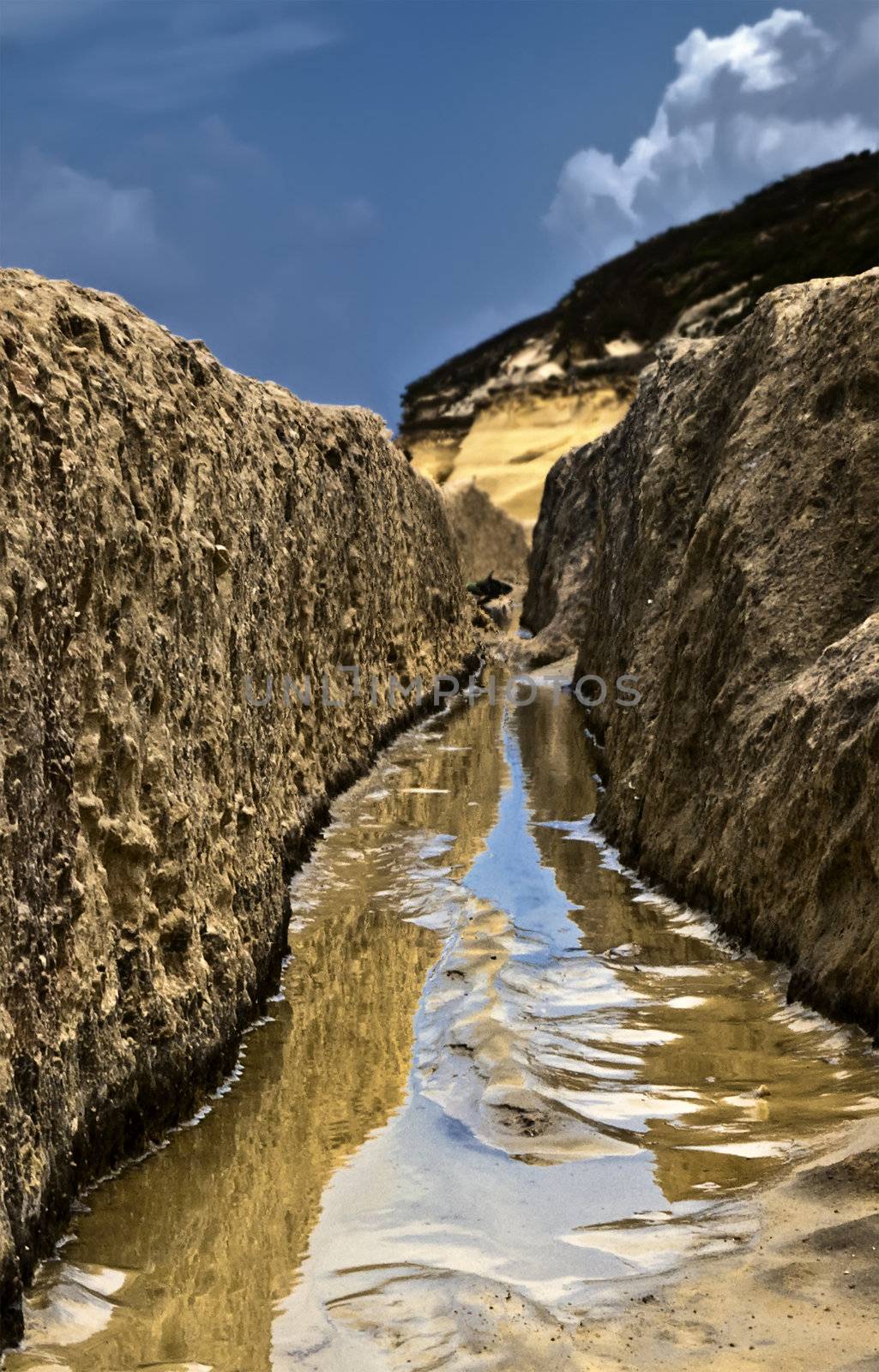 Image shot through rut carved in stone giving impression of a valley