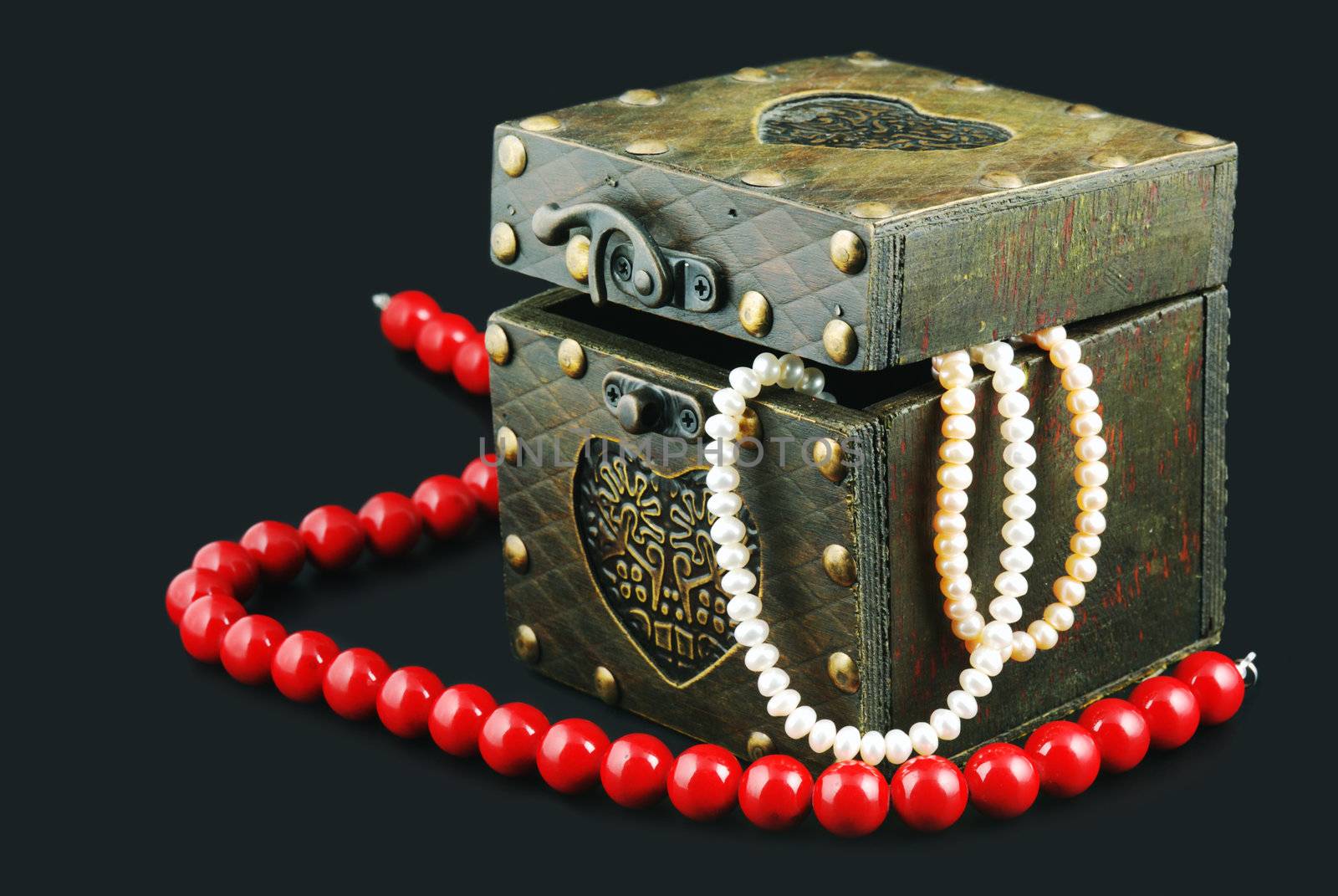 Casket with jewelry. Old, rough wooden boxes fixed by iron