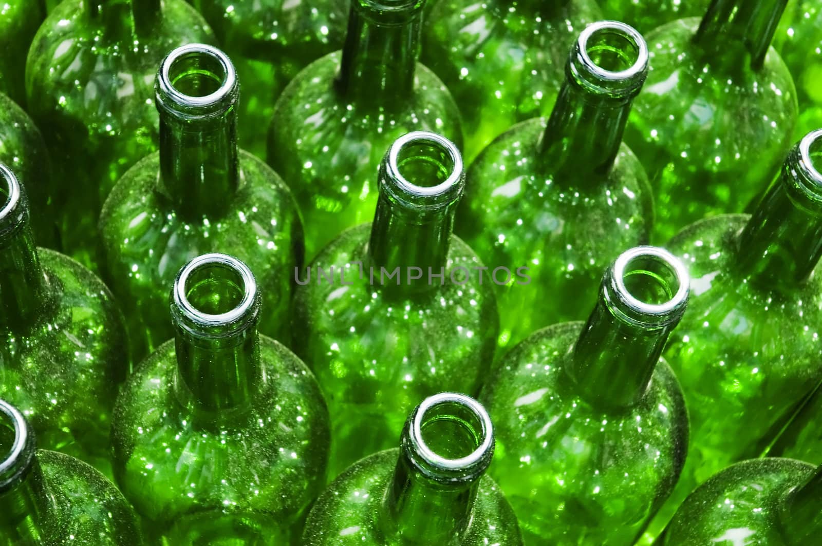 Stack of empty green glass bottles