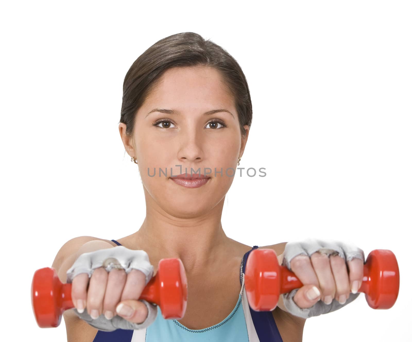 Portrait of a young woman doing barbells exercises.