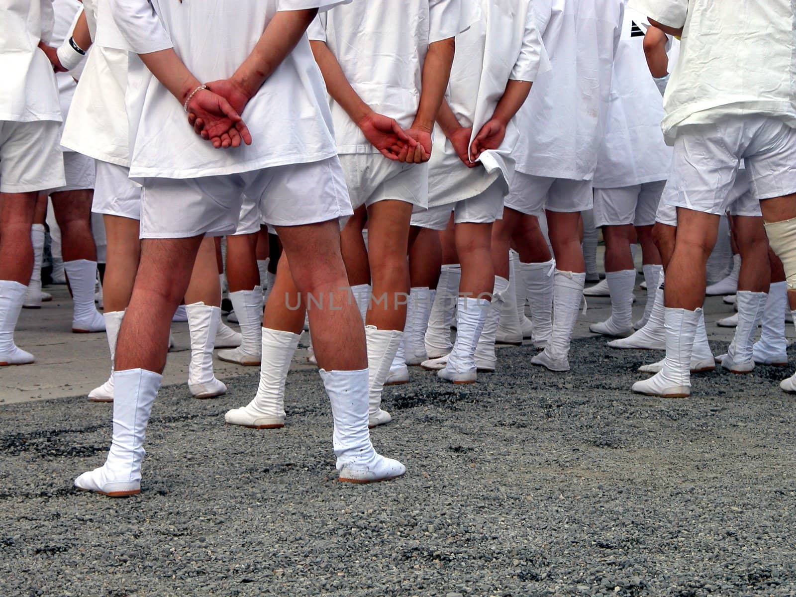   a mens group wearing specific japanese footwear during the biggest japanese festival:gion matsuri.        