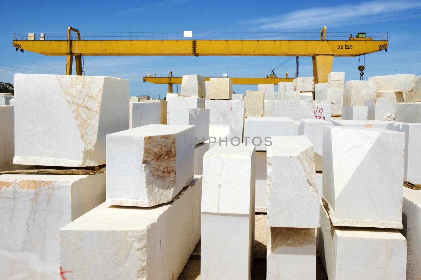 Marble blocks aligned in factory yard, Alentejo, Portugal