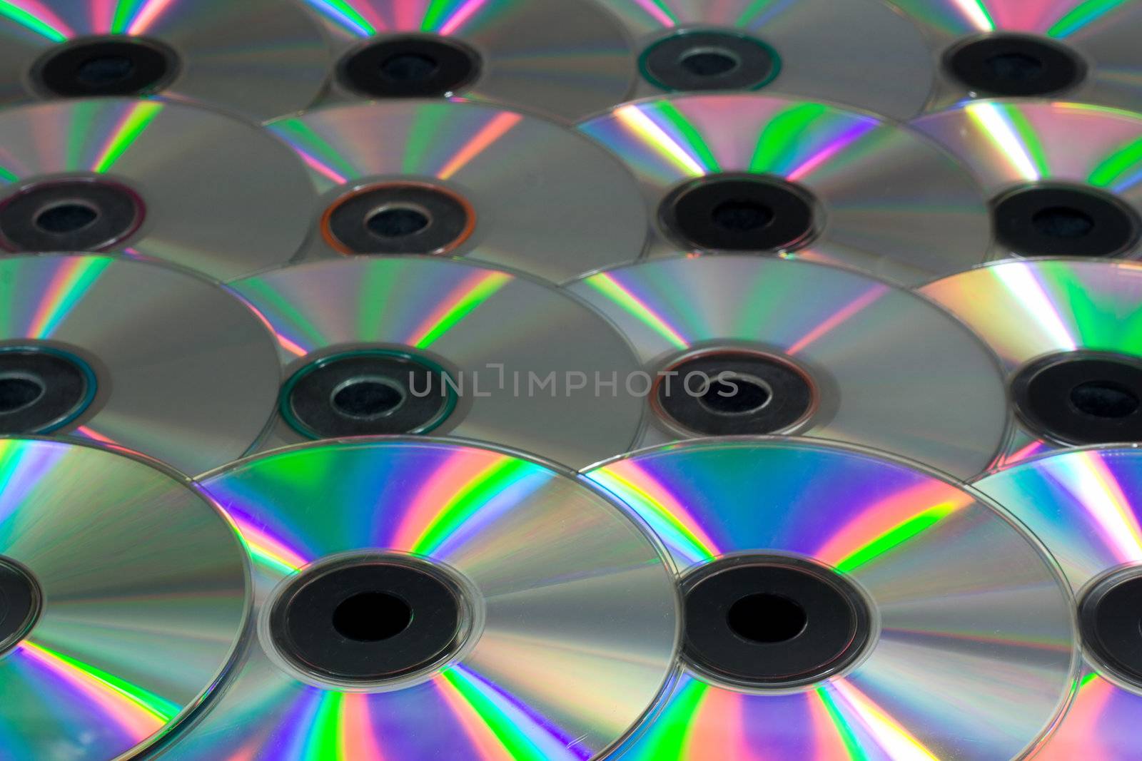 close-up many color compact disks as background