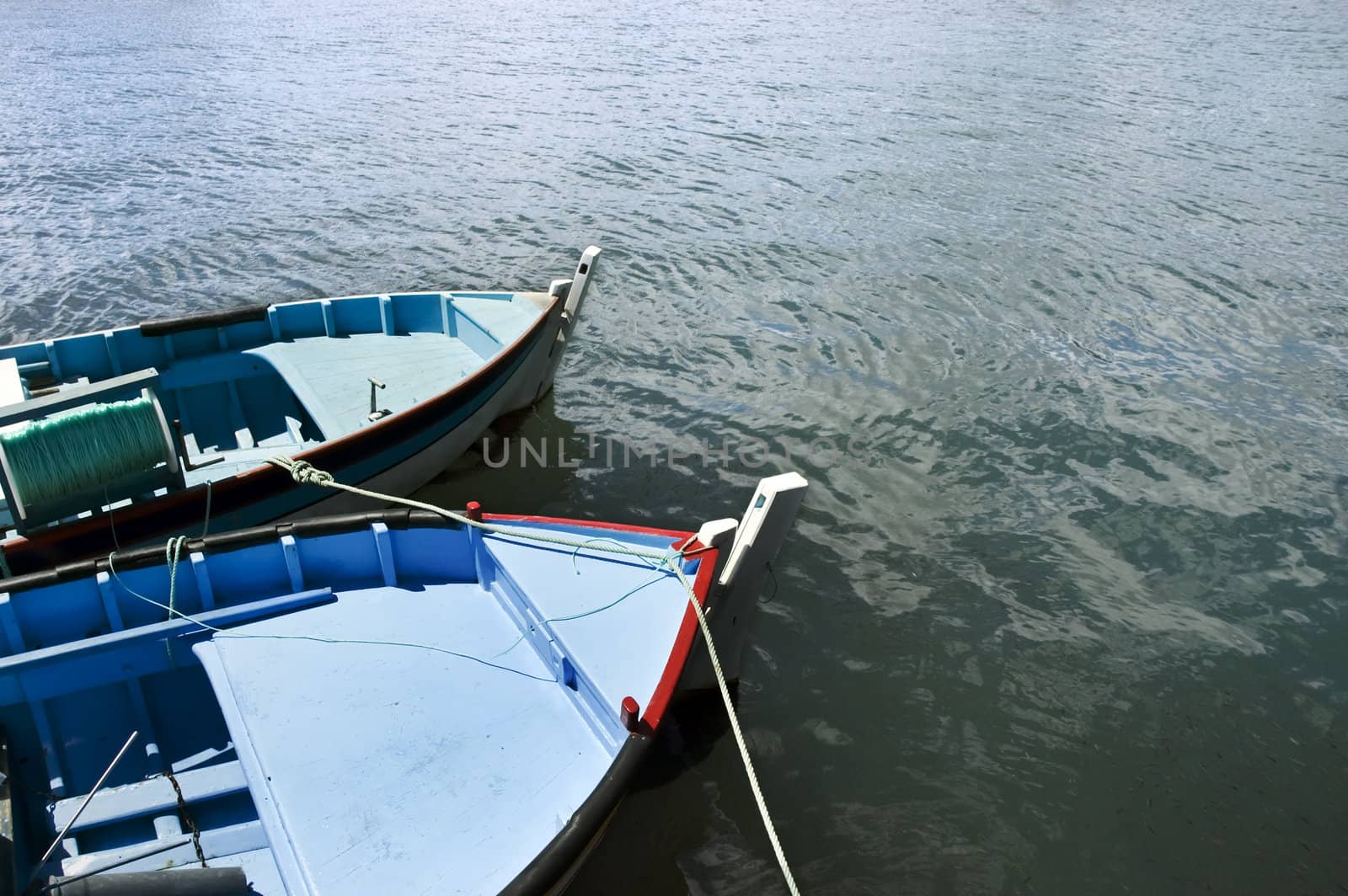 Couple of small fishing rowboats moored