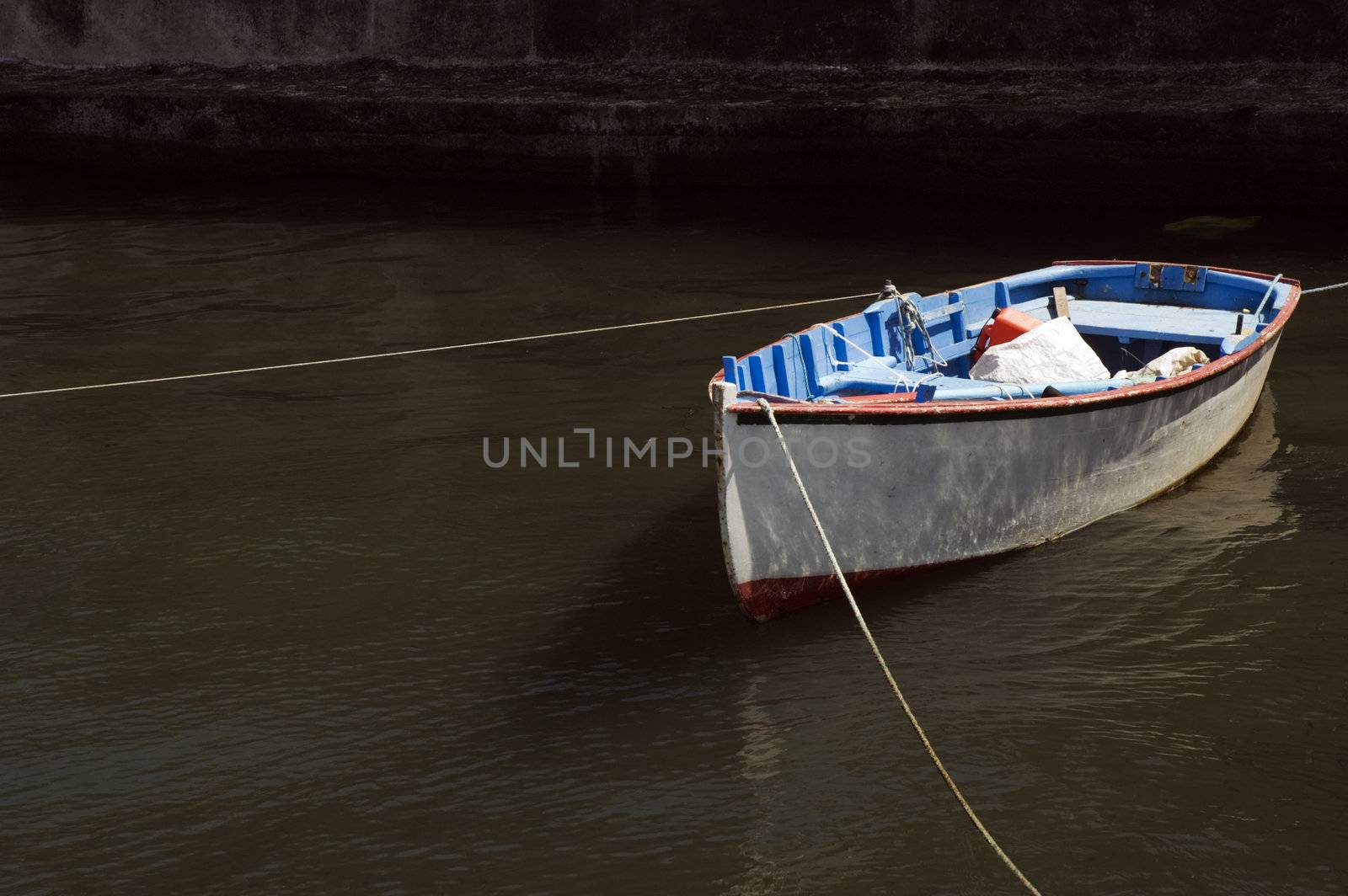 Small fishing rowboat moored