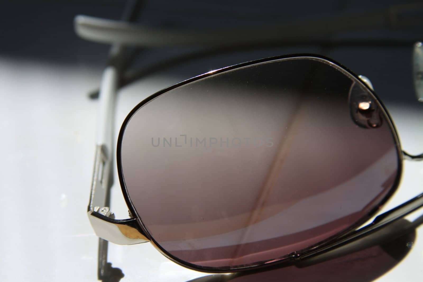 Close up of sunglasses on a white background.