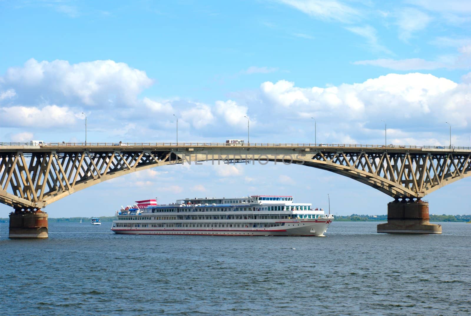 A ship passes under the bridge through the Volga River in Saratov.