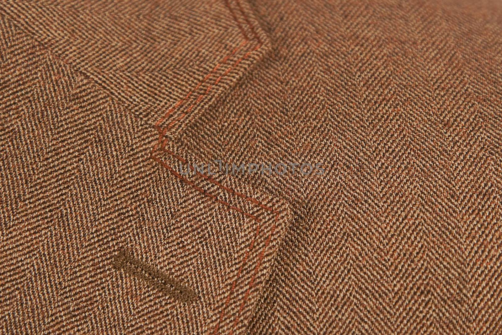 close-up of brown elegant buttonhole suit, textile classic