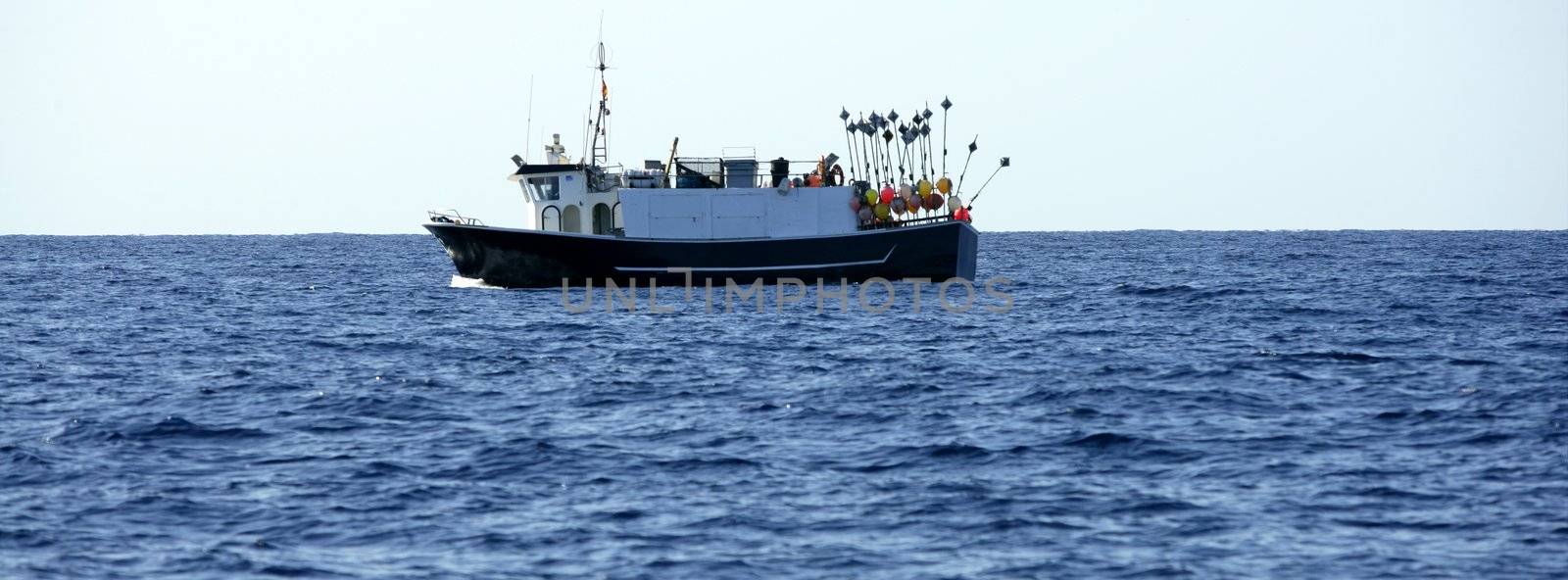 Mediterranean longliner boat working in Alicante by lunamarina