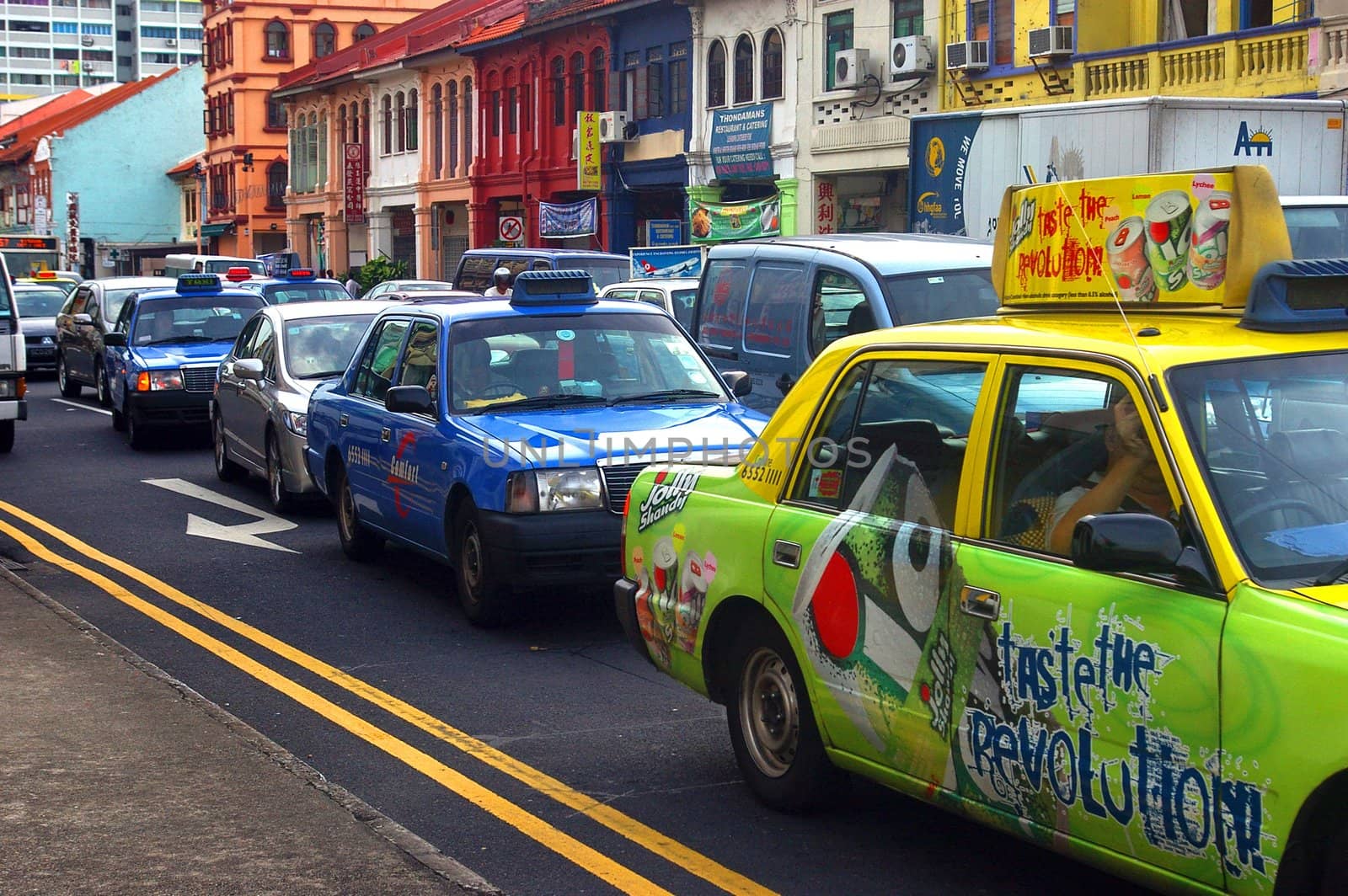 Cars and taxis fill the streets during rush hour in Singapore.