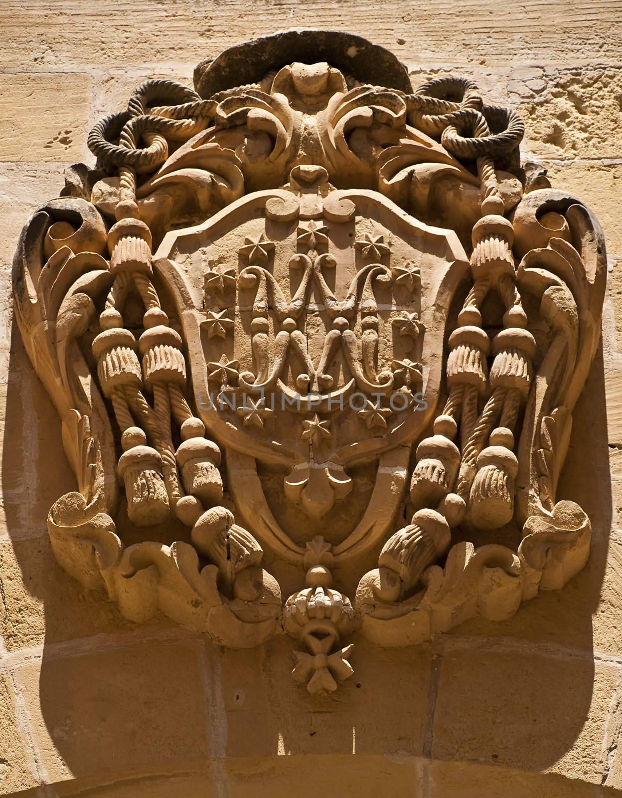 Coat of arms carved in limestone in the old Citadel in Gozo Malta