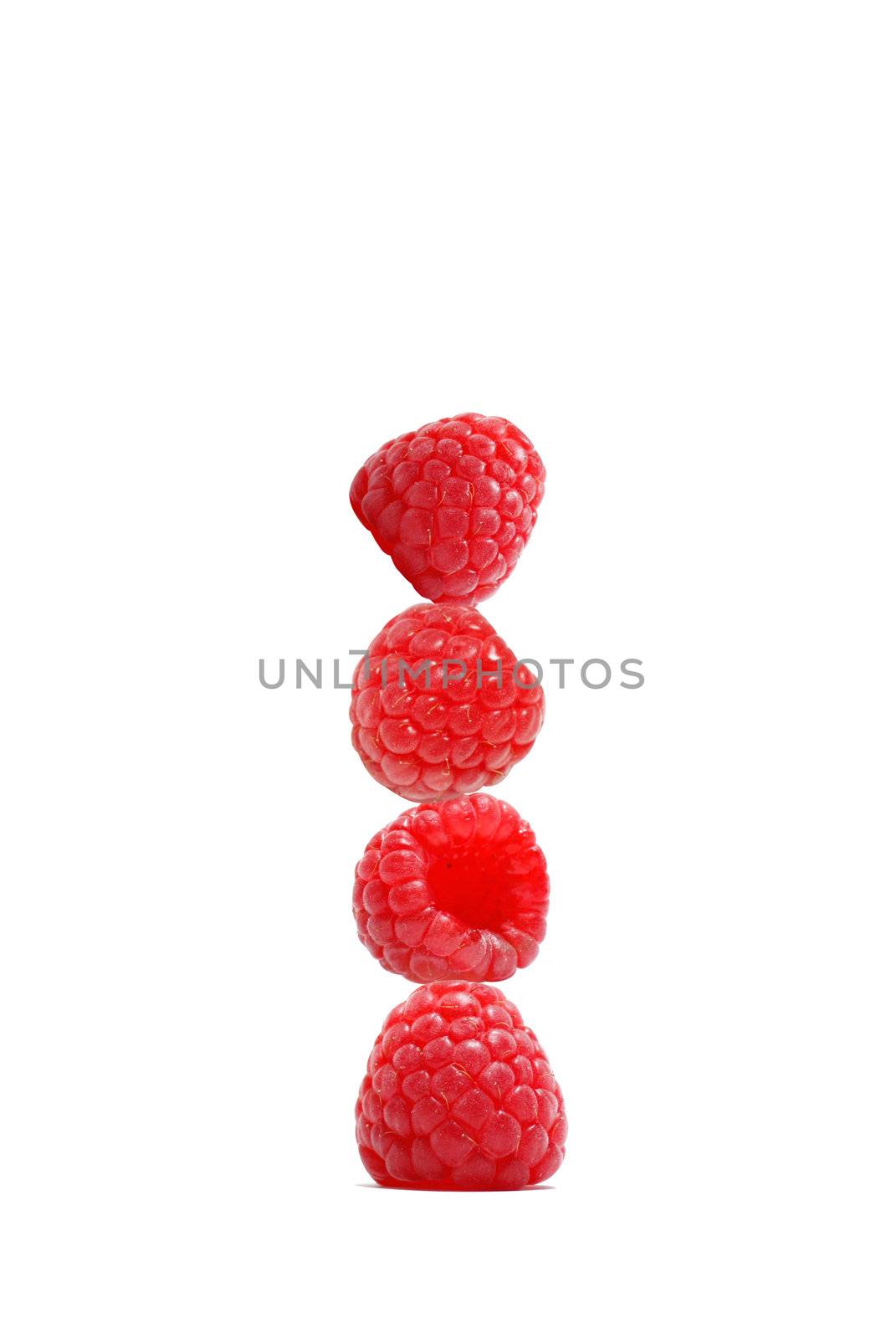 Delicious red raspberries on top of eachother