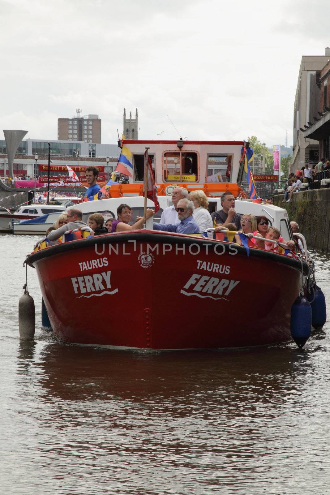A heavily laden ferry approaching the jetty near the Cascade Steps at Bordeaux Quay in Bristol's Floating Harbour during the 2009 Harbour Festival