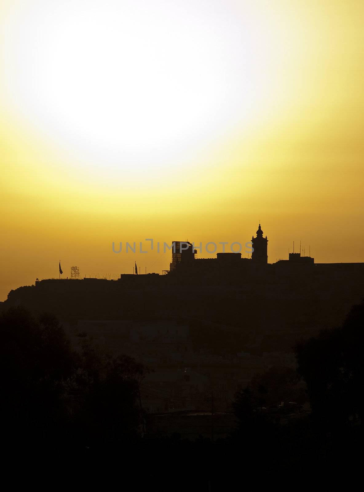 The Citadel in Gozo silhouetted by the setting sun