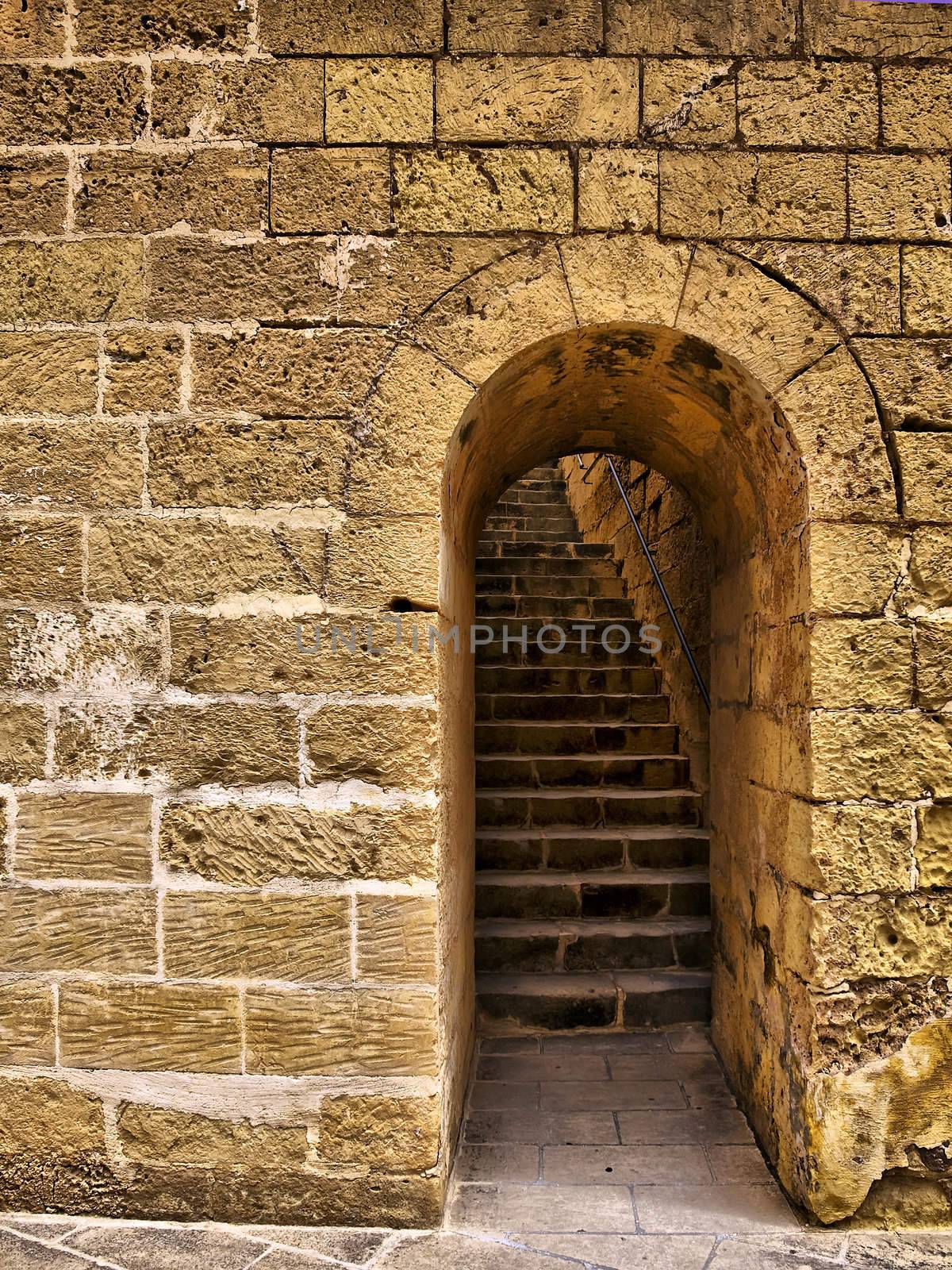 Arched doorway leading to steps to Citadel battery roof in Gozo