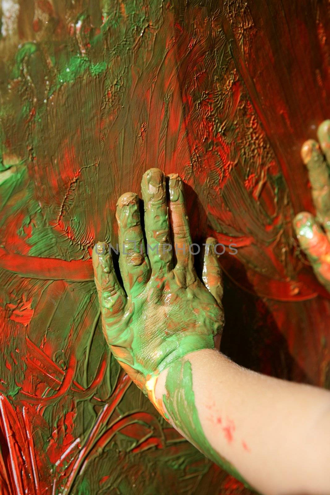 Children artist hands painting multi colors by lunamarina