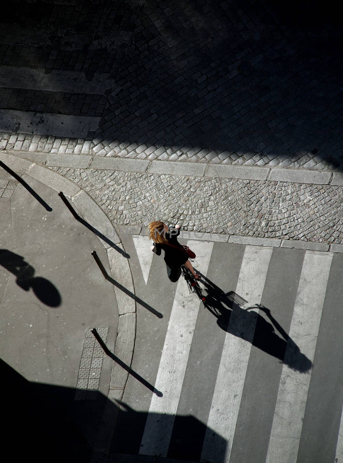 Girl riding bicycle in Paris.