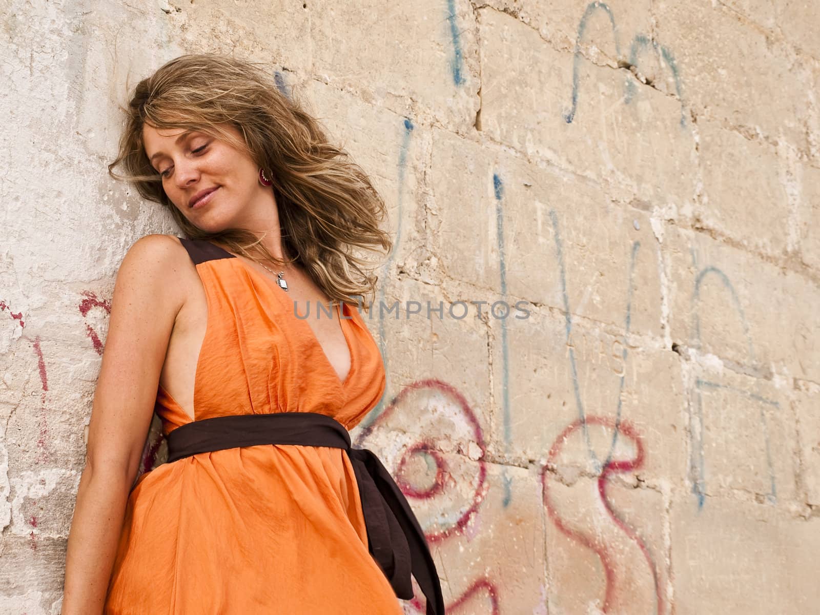 Beautiful fashion model in a dilapidated urban setting