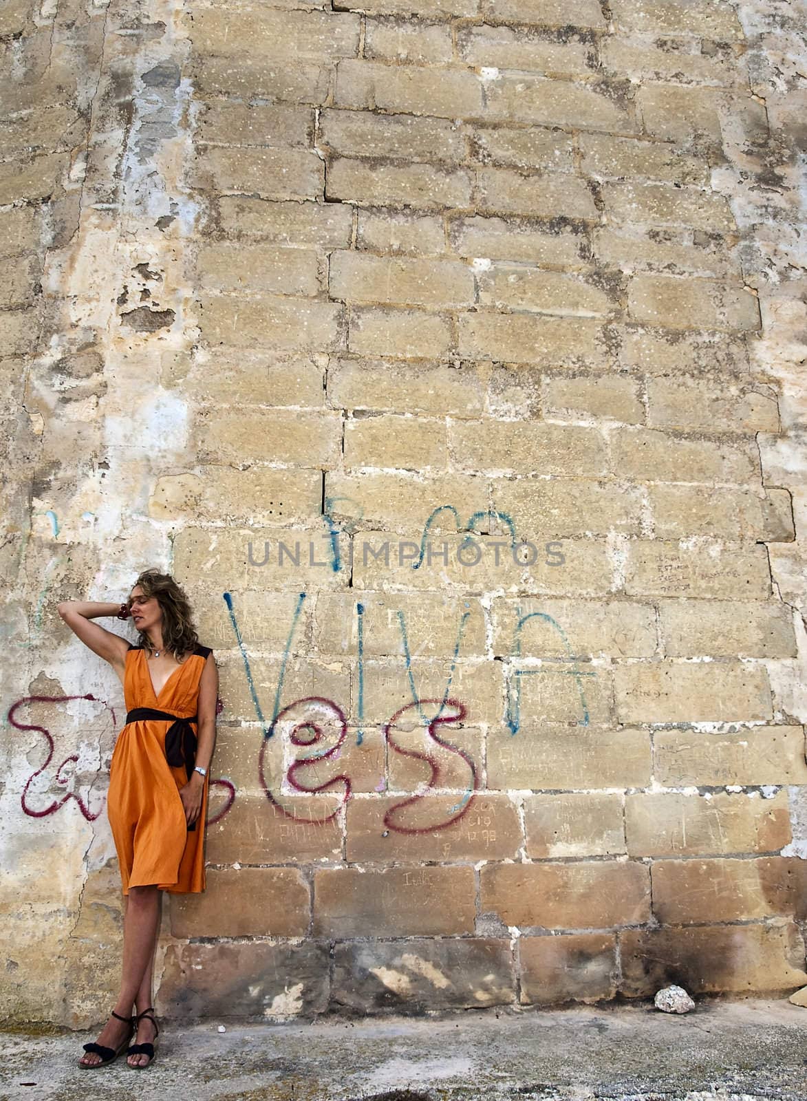 Beautiful fashion model in a dilapidated urban setting