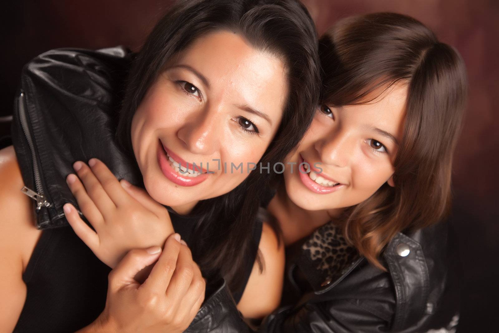 Attractive Hispanic Mother & Daughter Studio Portrait.