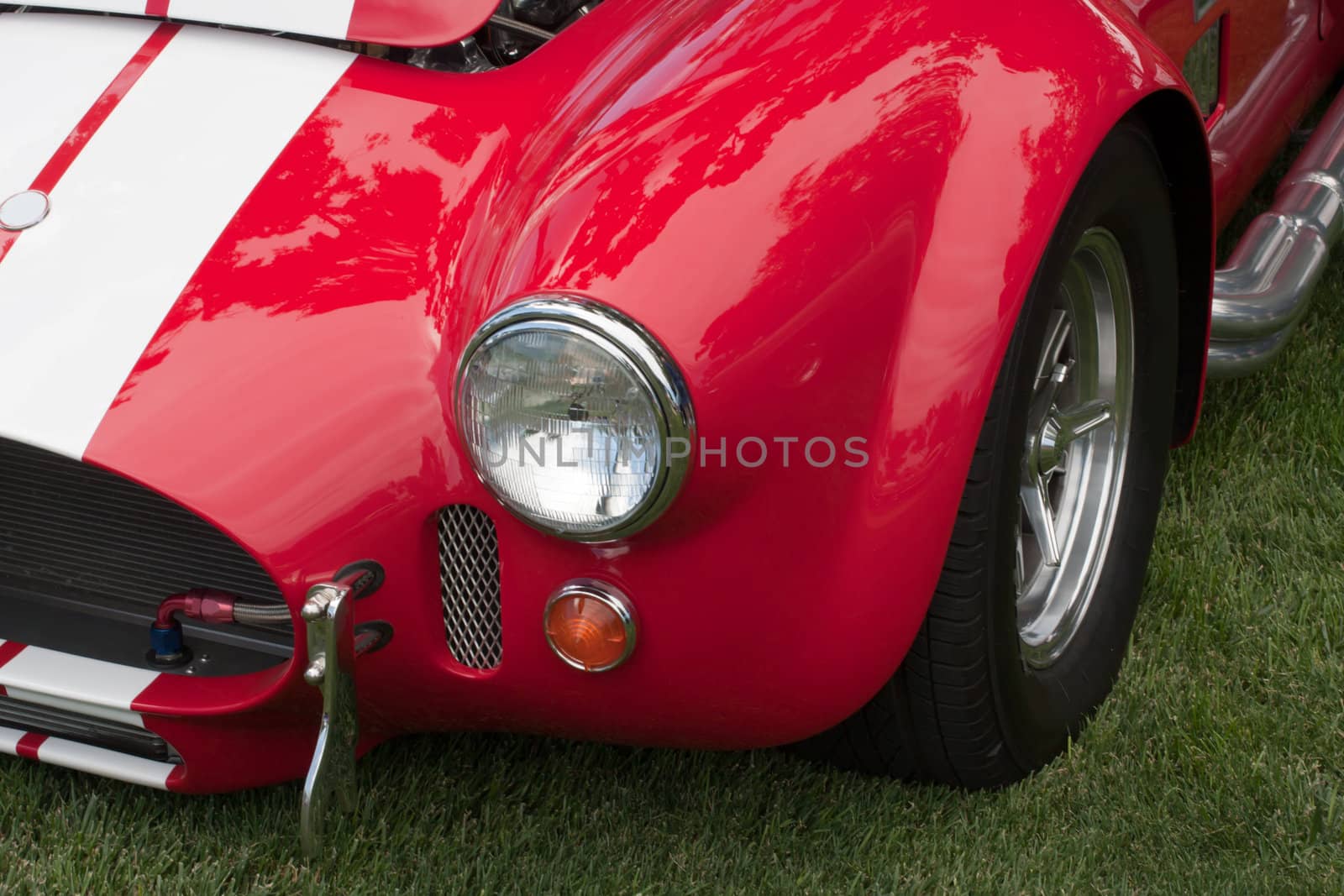front of a classic car with headlight and fender