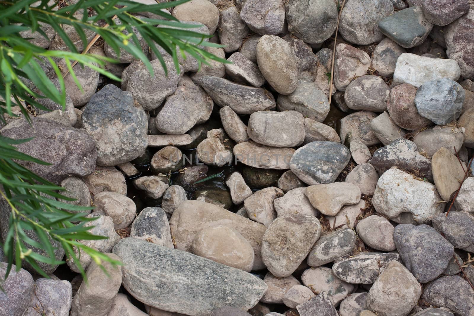 rocks in a pond as wallpaper or texture