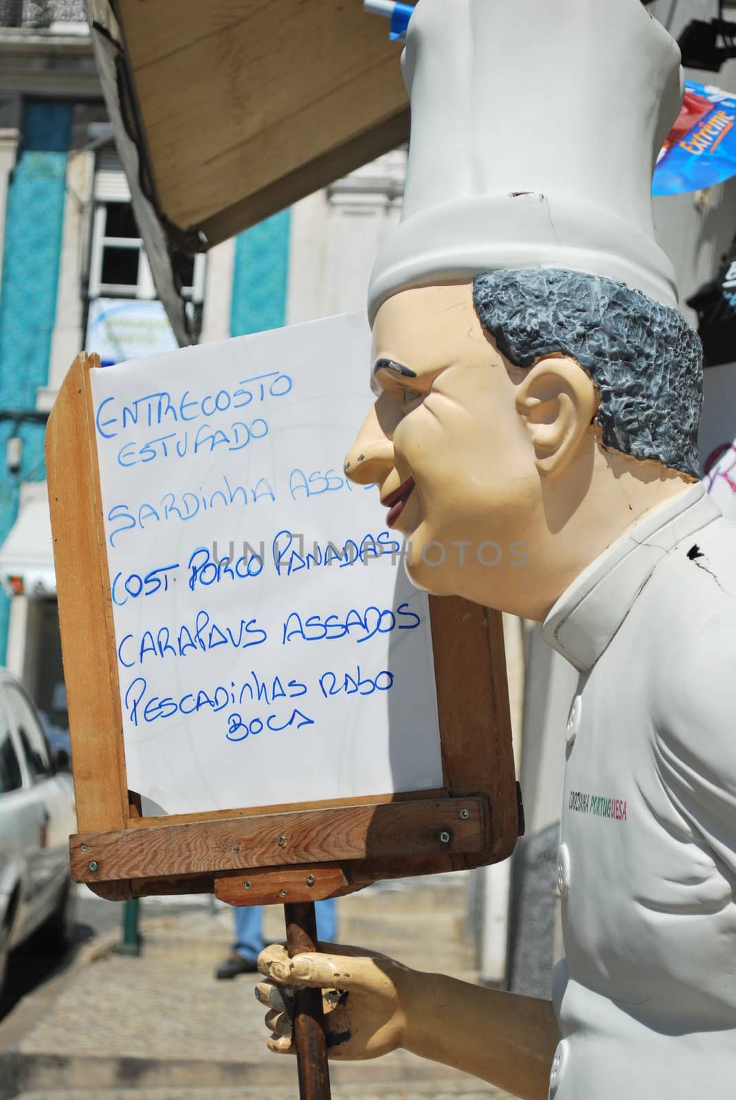 Chef holding whiteboard menu by luissantos84