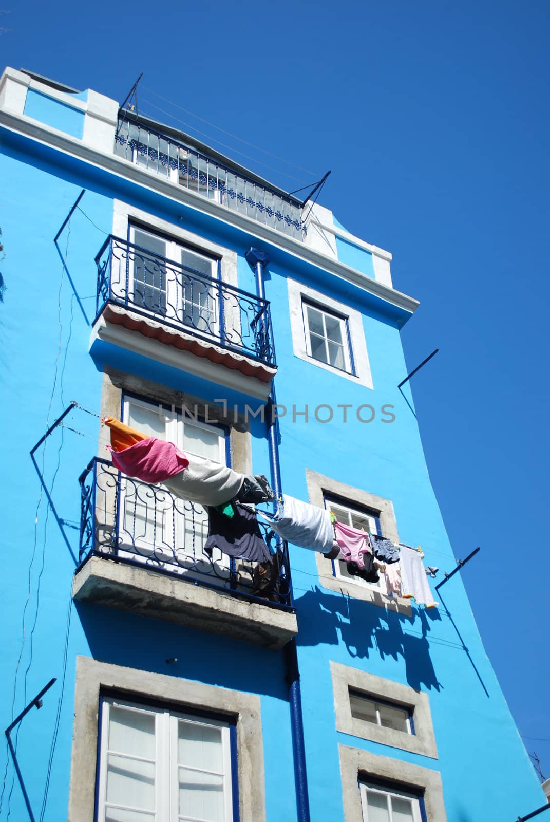 Clothes drying at the window on Lisbon's downtown by luissantos84