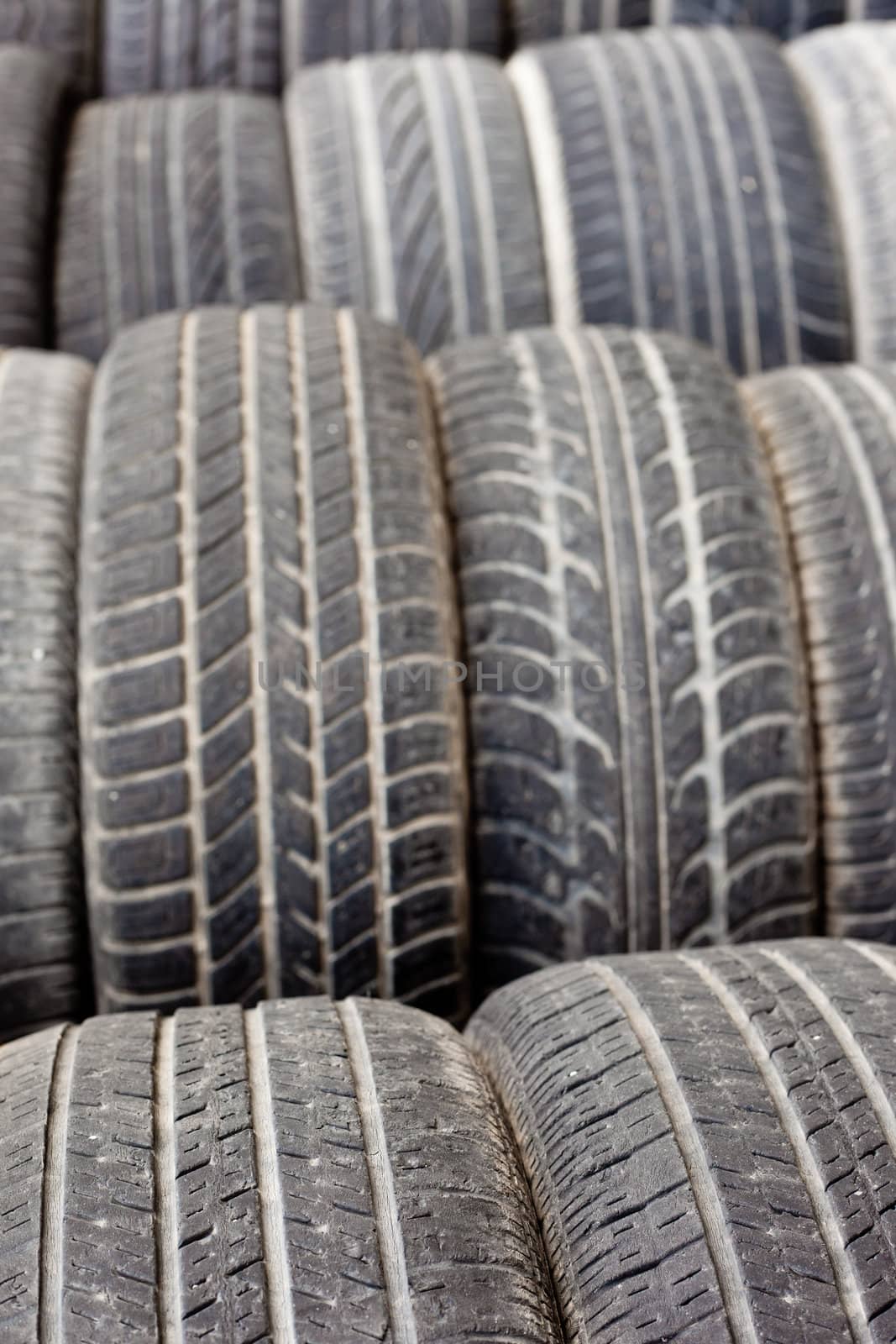 Background texture pattern of old tires for rubber recycling. Shallow DOF
