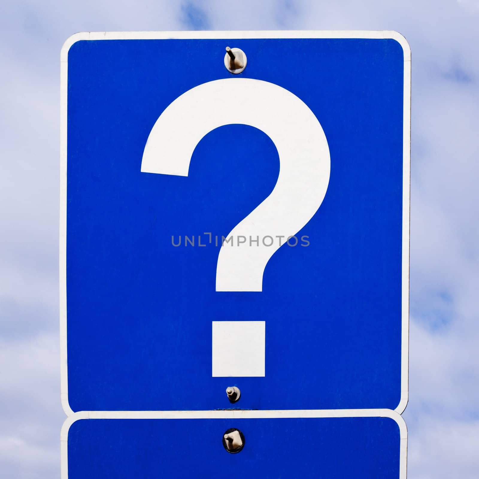 Blue road sign with just a single white question mark on it.
