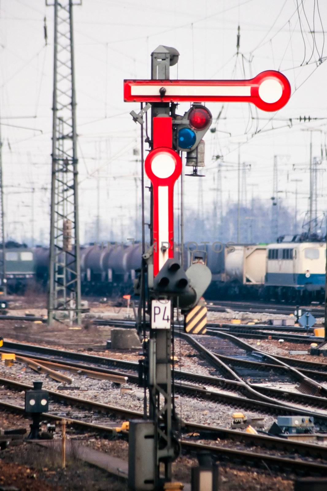 Old railway semaphore with propane signal light on cargo switching yard..