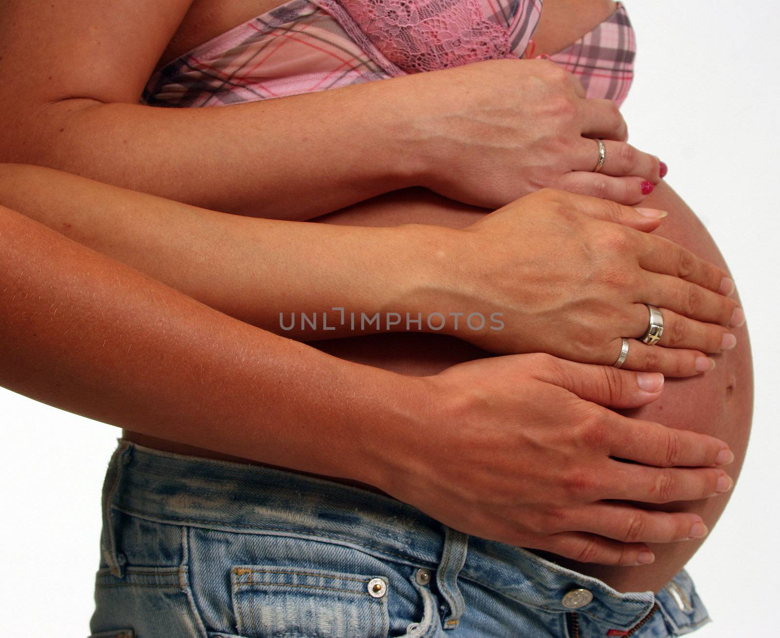 pregnant womens with hands on her belly