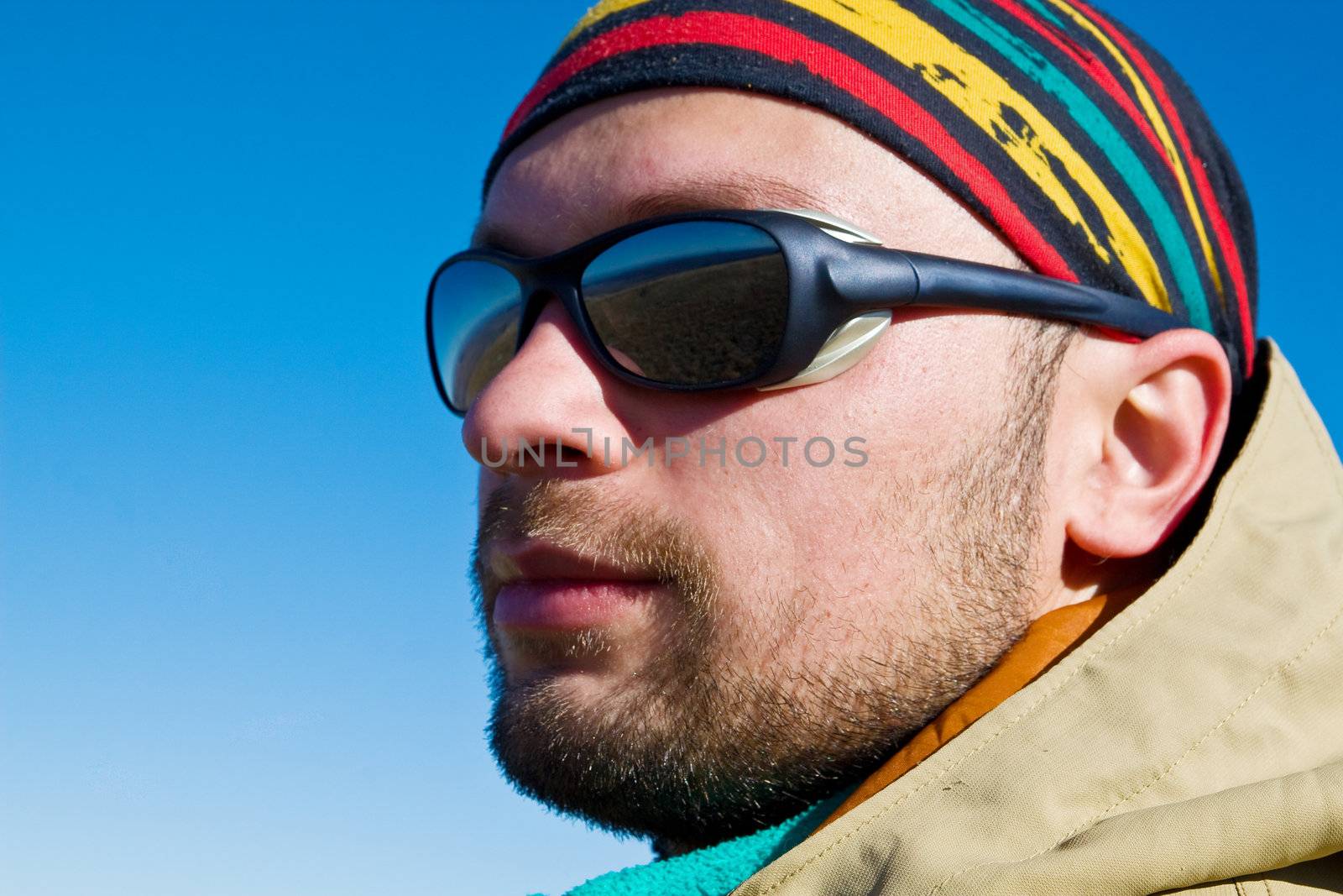 Hiker in sunglasses and colourful bandana