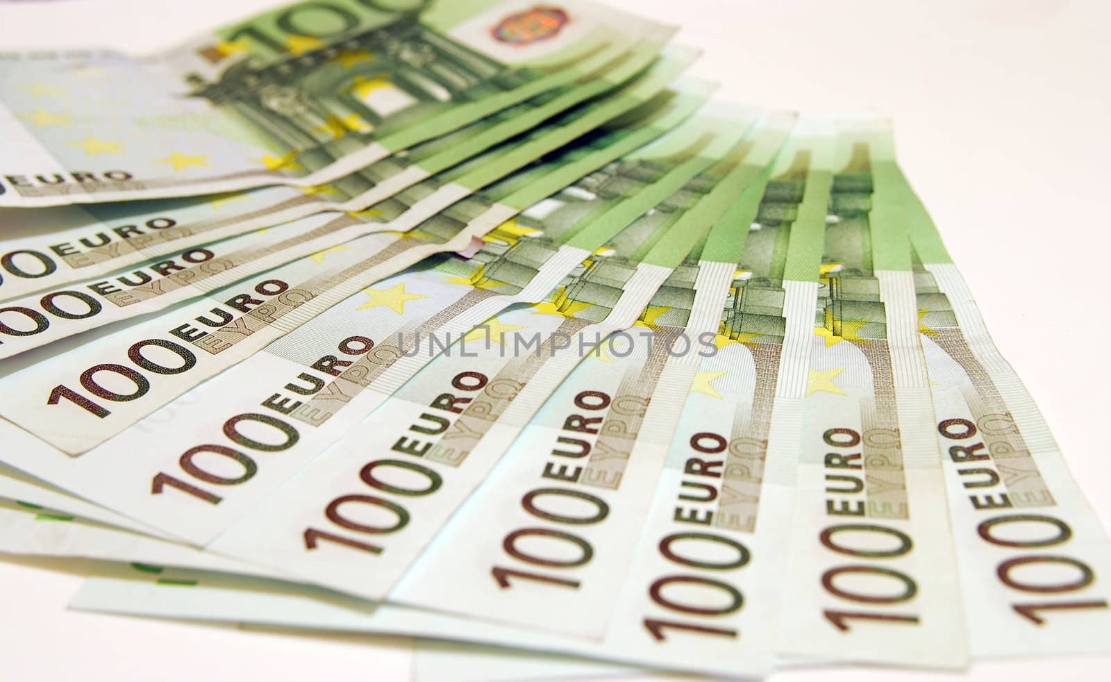 100 Euro notes on a white background.
