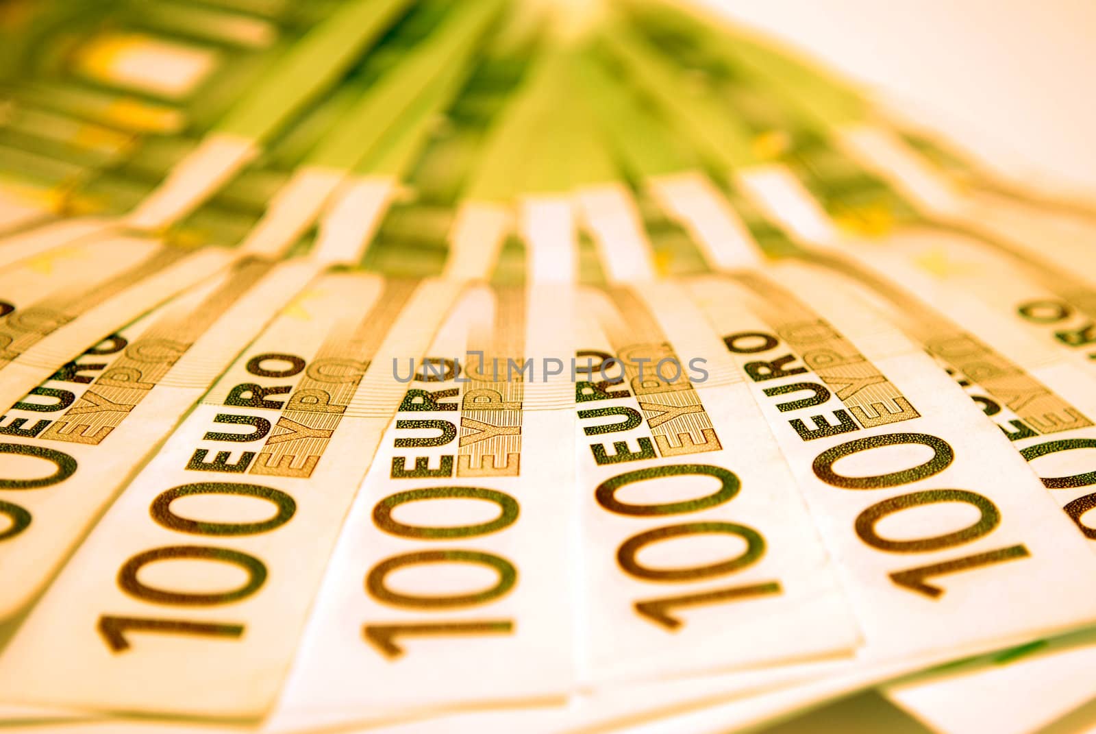 100 Euro notes on a white background.
