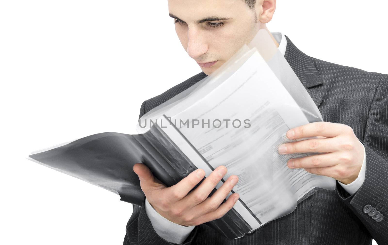 Young business man reading a contract