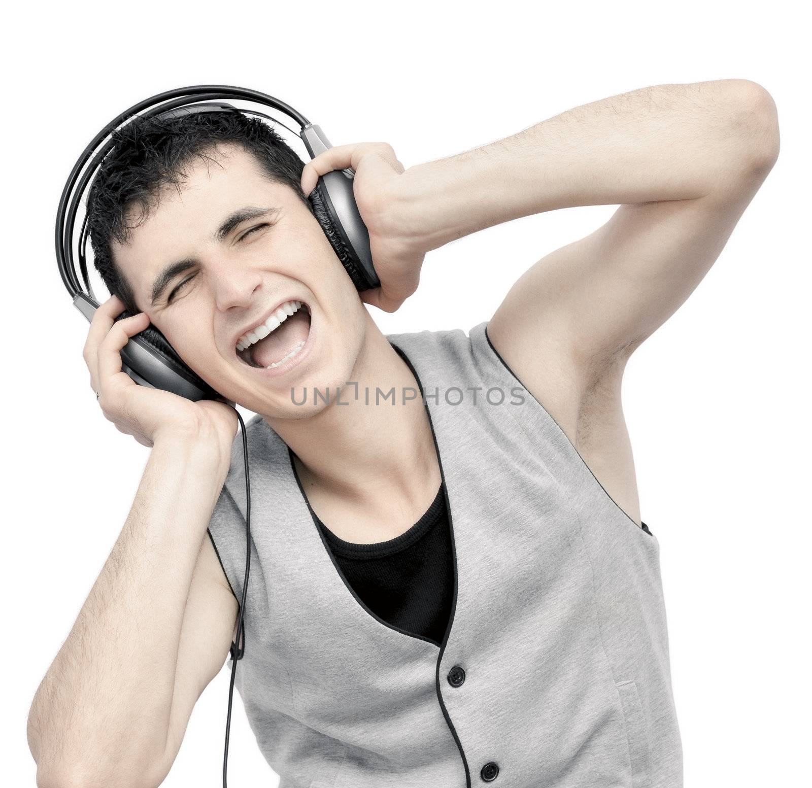 Teenager listening music on headphones isolated on white background:NOTE:Grain was added.Strong contrast photography